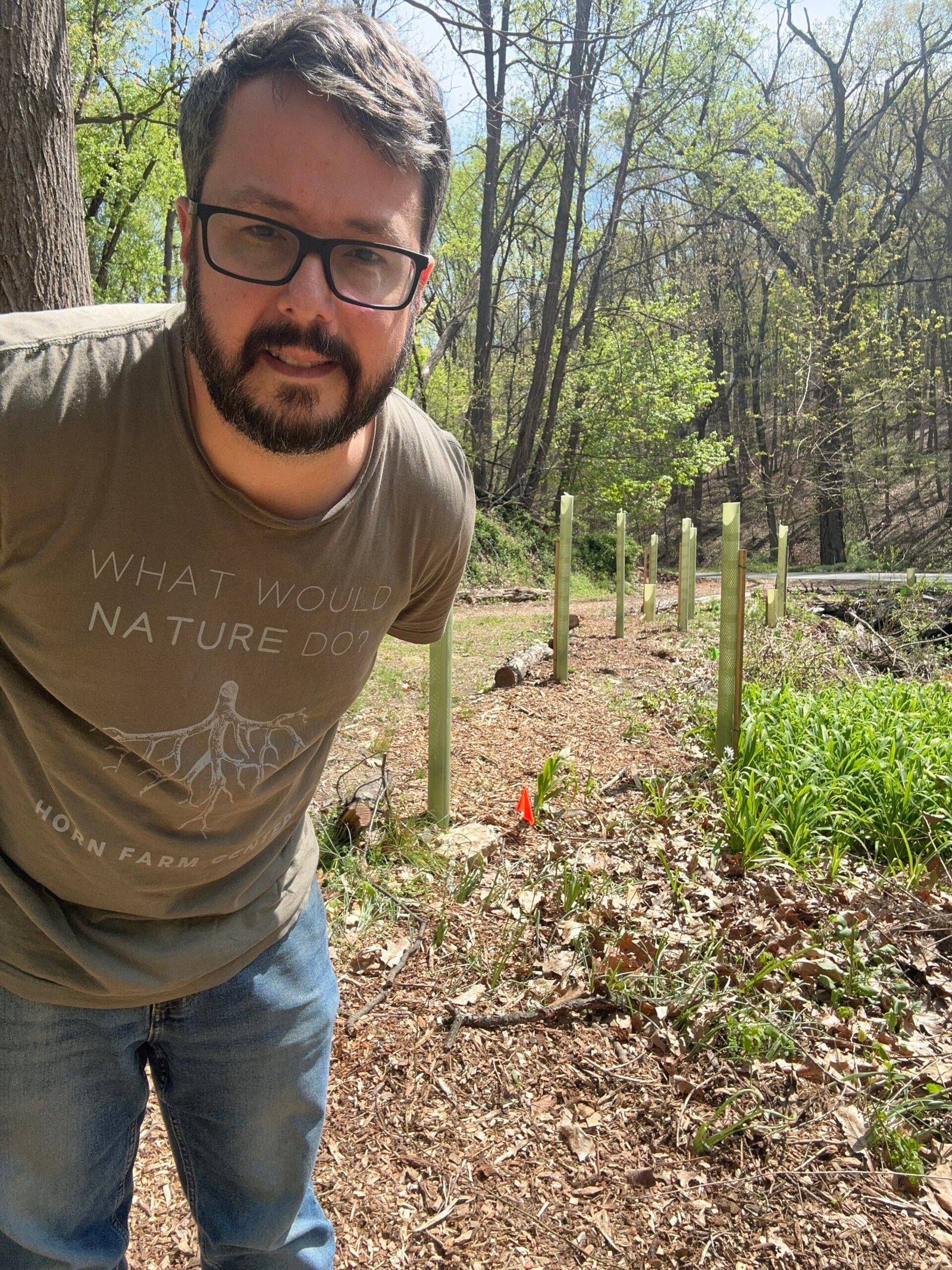Allen Clements among young trees at Dark Hollow Biodynamic