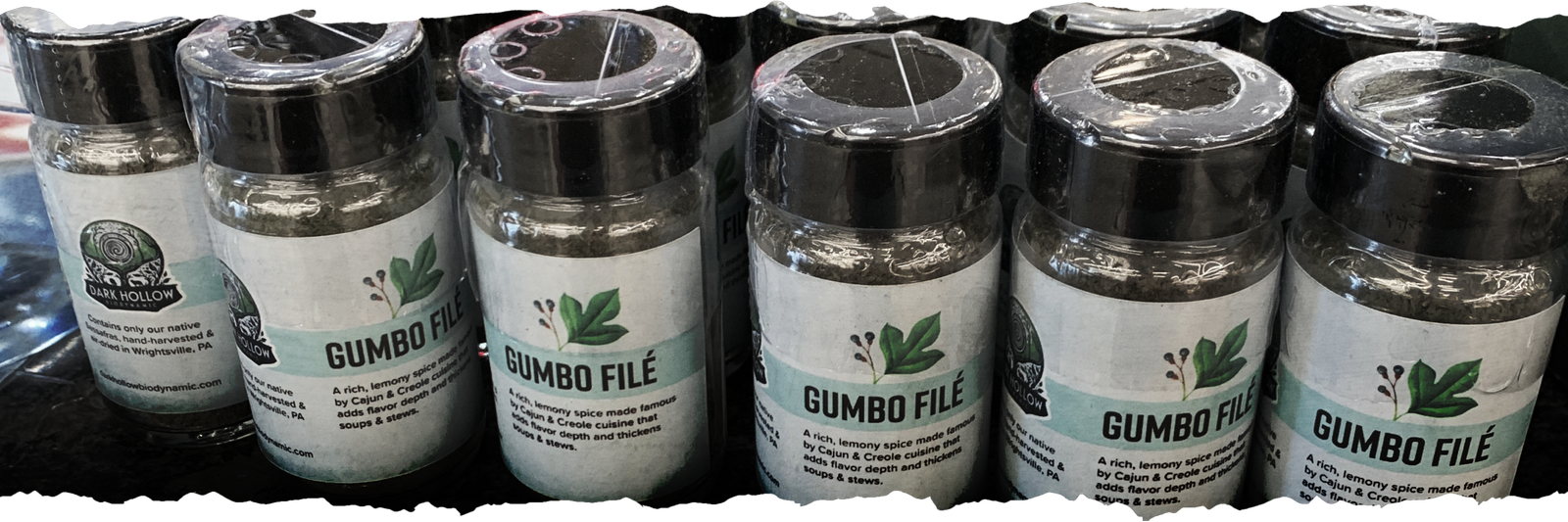Rows of Dark Hollow gumbo filé bottles